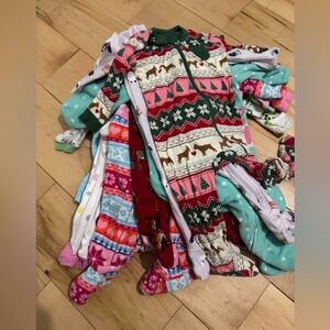 Bundle 11 pyjamas footies . 6M . All new just washed .